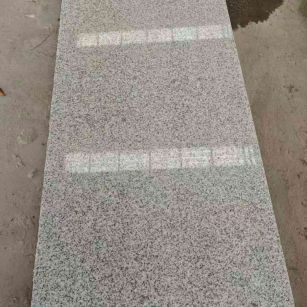 六安芝麻白光面毛板